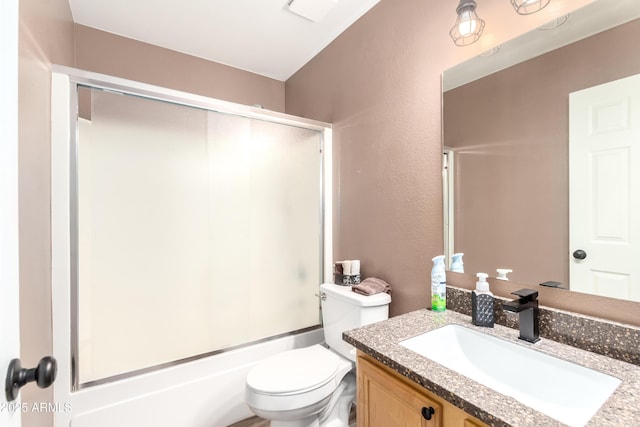 8637 W Kathleen Rd, Peoria, AZ 85382 - bathroom featuring vanity, toilet, a textured wall, and shower / bath combination with glass door