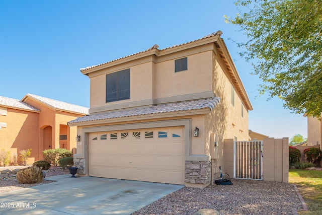 8637 W Kathleen Rd, Peoria, AZ 85382 - mediterranean / spanish-style home featuring a tile roof, stucco siding, a garage, stone siding, and driveway
