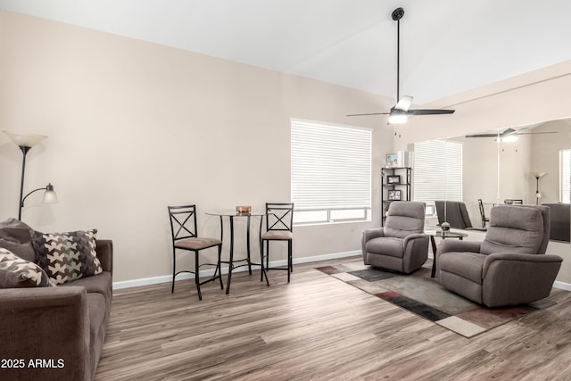 8637 W Kathleen Rd, Peoria, AZ 85382 - living room featuring vaulted ceiling, wood finished floors, a ceiling fan, and baseboards