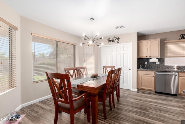 8637 W Kathleen Rd, Peoria, AZ 85382 - dining space featuring a healthy amount of sunlight, wood finished floors, visible vents, and a chandelier