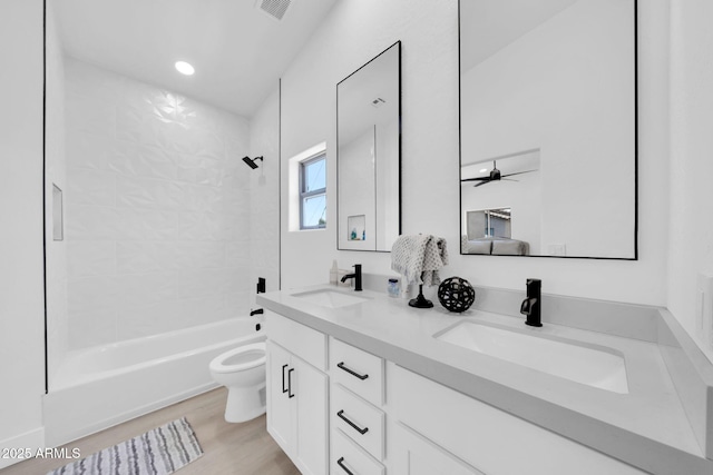 3034 N 39th St Unit 12, Phoenix, AZ 85018 - bathroom featuring double vanity, shower / bath combination, wood finished floors, ceiling fan, and recessed lighting