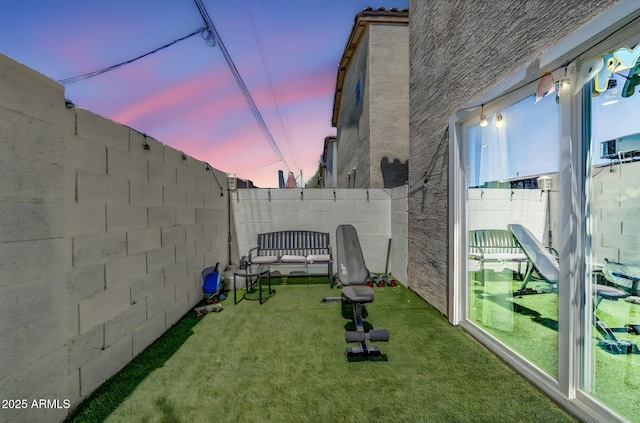 3034 N 39th St Unit 12, Phoenix, AZ 85018 - yard at dusk with a fenced backyard