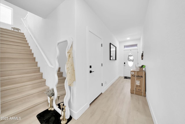 3034 N 39th St Unit 12, Phoenix, AZ 85018 - hallway with stairs and light wood finished floors