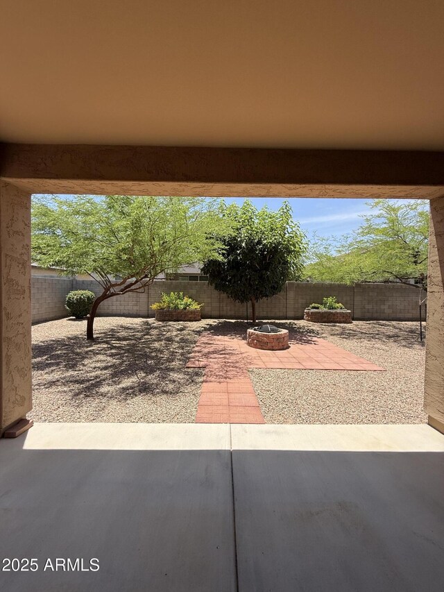 1241 E Palo Verde Dr, Casa Grande, AZ 85122 - fenced backyard with a fire pit and a patio
