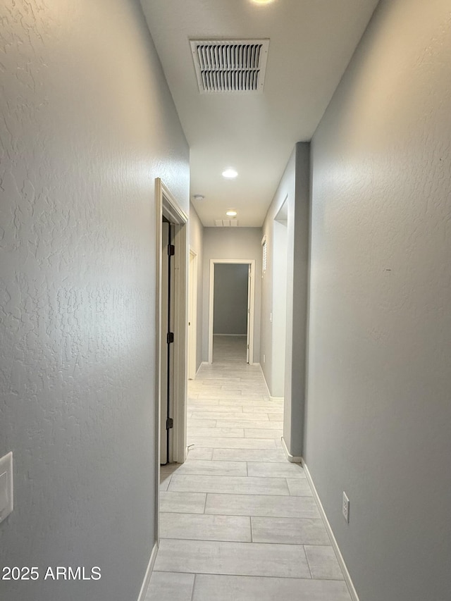 1241 E Palo Verde Dr, Casa Grande, AZ 85122 - corridor featuring baseboards and light wood-type flooring