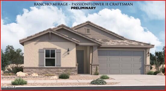 view of front facade with an attached garage, driveway, stucco siding, and stone siding