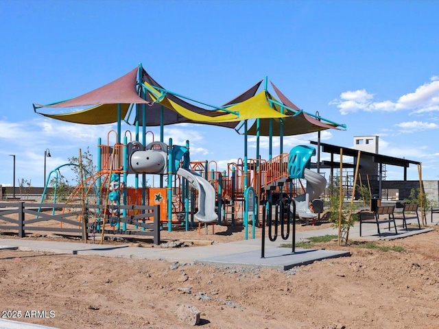 community jungle gym featuring fence
