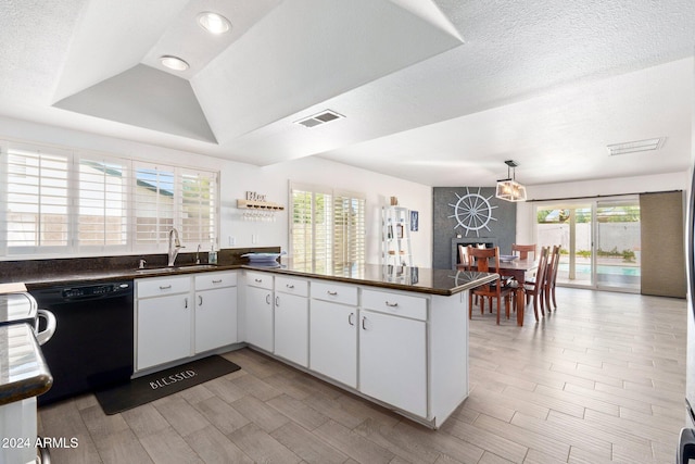 kitchen with plenty of natural light, sink, black dishwasher, and white cabinets