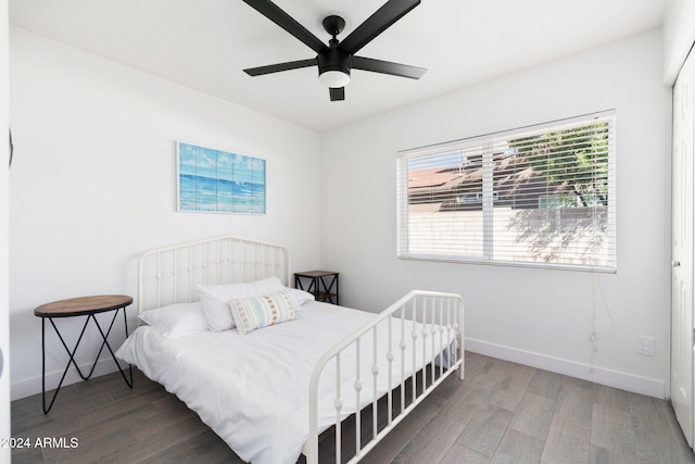 bedroom with hardwood / wood-style floors and ceiling fan