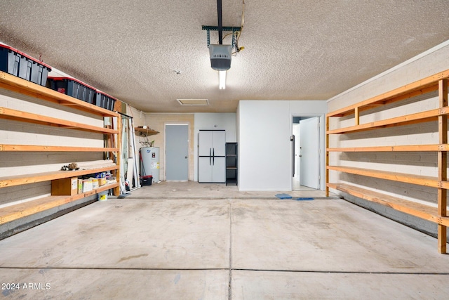 garage with water heater and a garage door opener