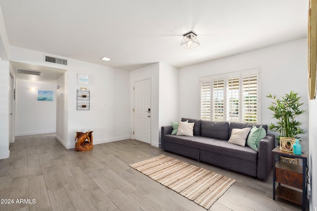 living room with light hardwood / wood-style flooring