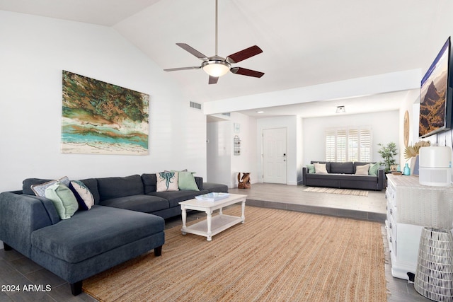 living room featuring hardwood / wood-style floors, vaulted ceiling, and ceiling fan