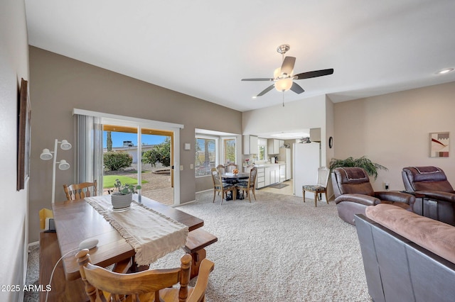 carpeted living room featuring ceiling fan