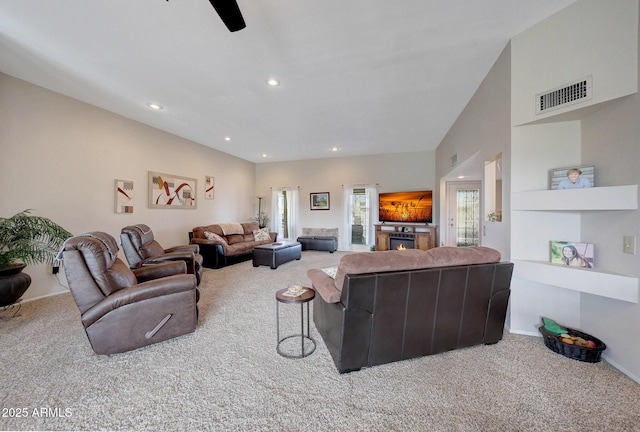 living room with carpet floors and ceiling fan