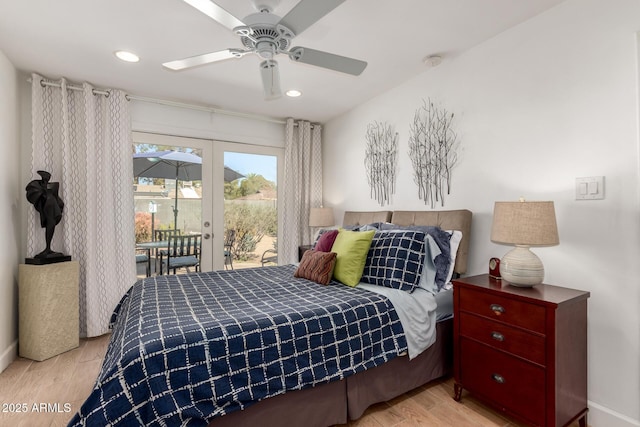 bedroom featuring recessed lighting, french doors, wood finished floors, and access to exterior