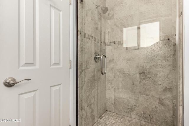 full bathroom featuring a shower stall