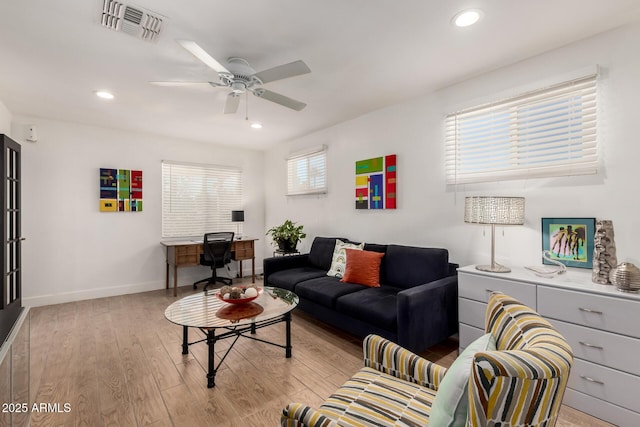 living room featuring visible vents, recessed lighting, light wood-style floors, baseboards, and ceiling fan