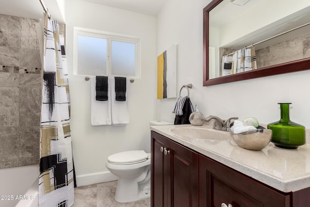 bathroom featuring tile patterned floors, baseboards, toilet, and vanity