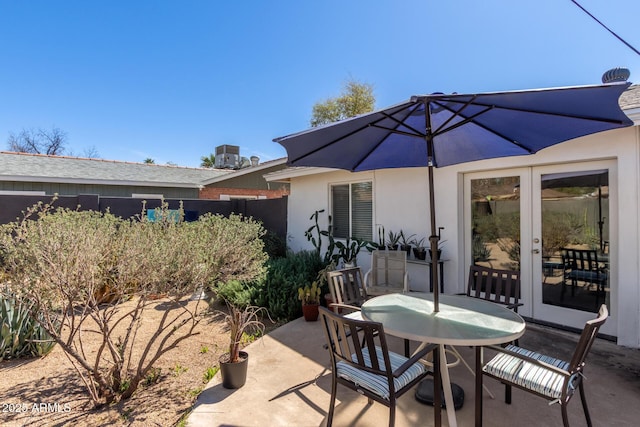 view of patio with outdoor dining space and central air condition unit