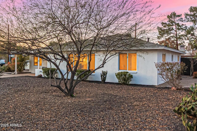 back of property with stucco siding