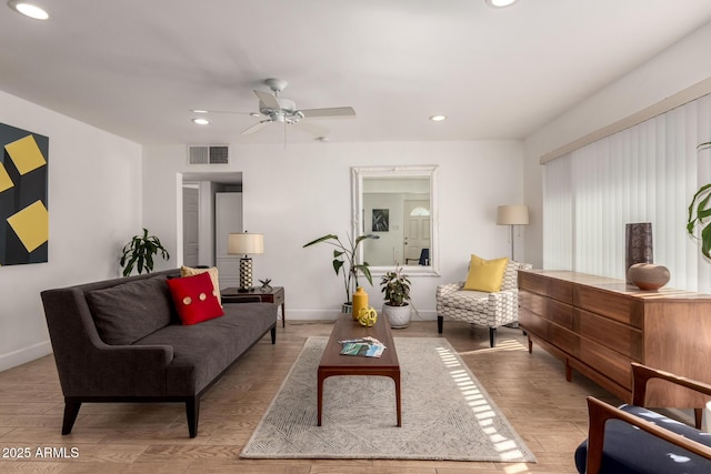 living room featuring wood finished floors, visible vents, baseboards, recessed lighting, and ceiling fan