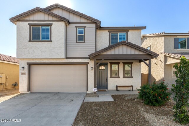 view of front of house featuring stucco siding, an attached garage, concrete driveway, and board and batten siding