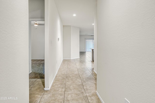 hallway with light tile patterned floors