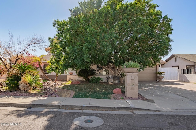 obstructed view of property with a garage