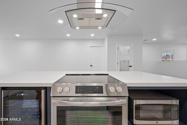 kitchen featuring stainless steel appliances and wine cooler