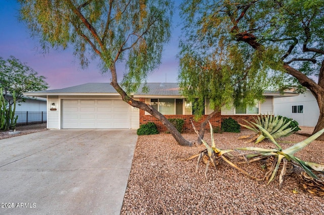 single story home featuring a garage