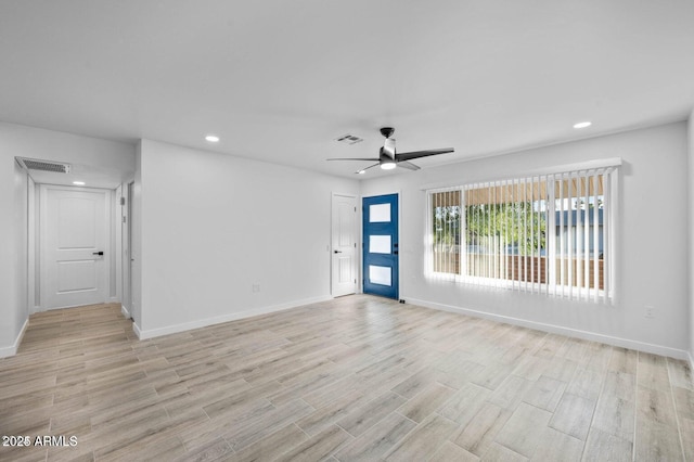 unfurnished room with ceiling fan