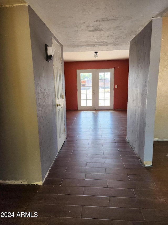 hall featuring french doors and dark hardwood / wood-style floors