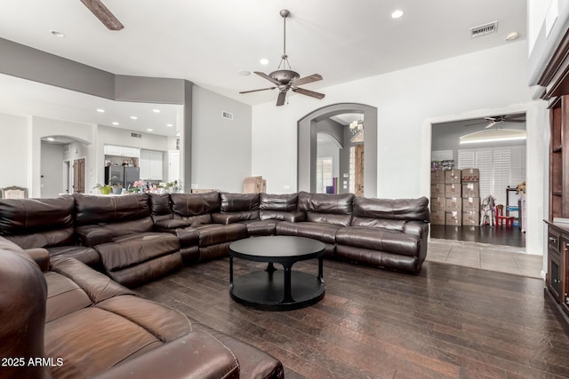 living room featuring ceiling fan and hardwood / wood-style floors