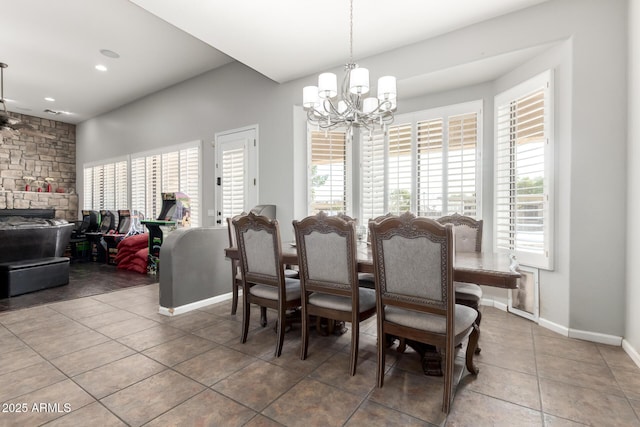 dining area featuring tile patterned floors and a notable chandelier