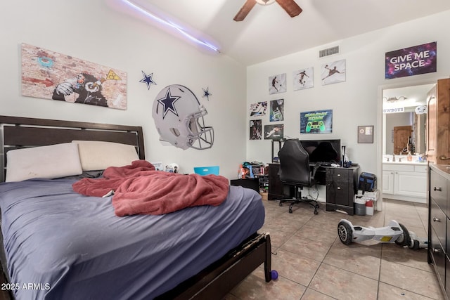 bedroom with ceiling fan, ensuite bath, and light tile patterned floors