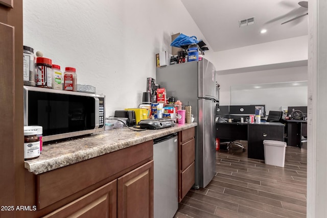 kitchen with ceiling fan and appliances with stainless steel finishes