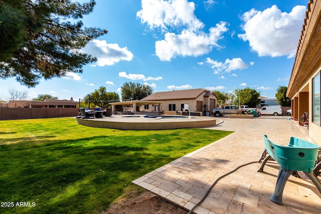 view of yard with a fenced in pool and a patio