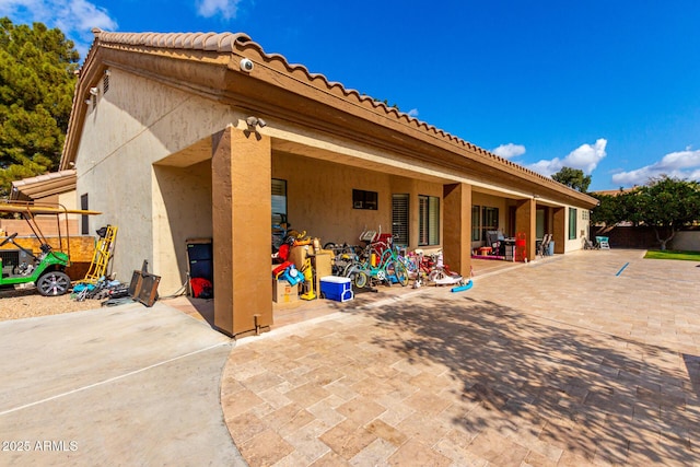 rear view of property featuring a patio