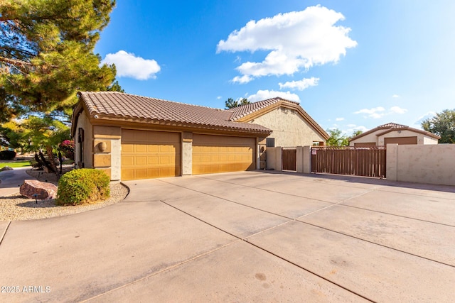 mediterranean / spanish house featuring a garage