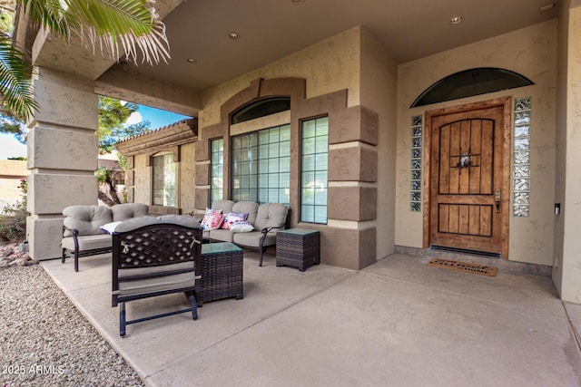 exterior space featuring an outdoor hangout area and a patio