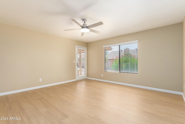 empty room featuring light hardwood / wood-style floors and ceiling fan