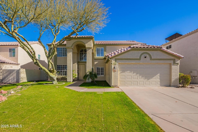 mediterranean / spanish home with a garage and a front lawn