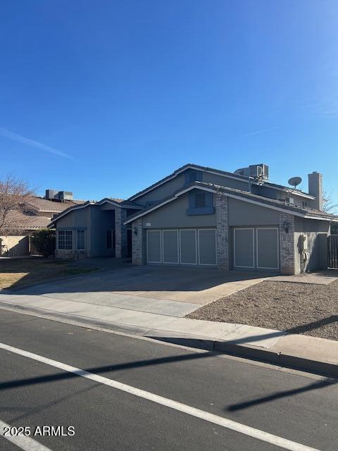 view of front of home with driveway and an attached garage