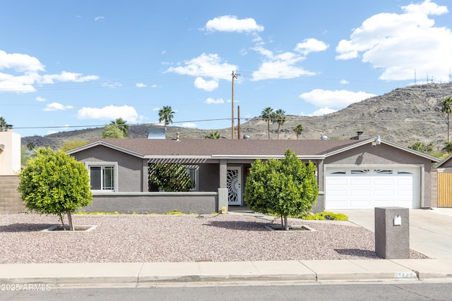 1445 W Wood Dr, Phoenix, AZ 85029 - ranch-style house featuring driveway, stucco siding, a mountain view, and a garage