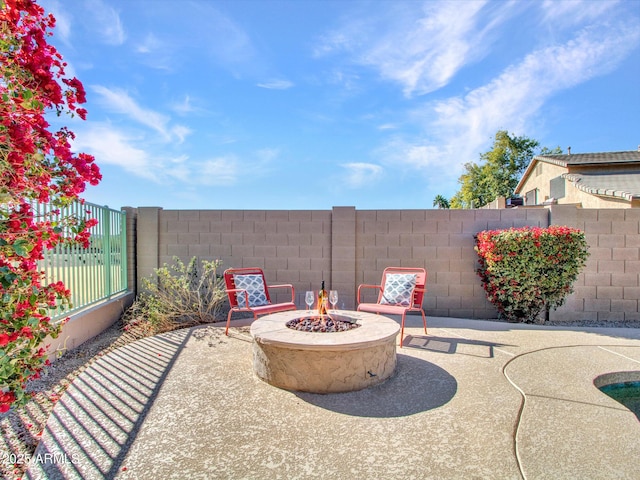 view of patio with a fire pit