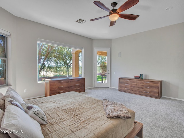 carpeted bedroom with access to outside and ceiling fan