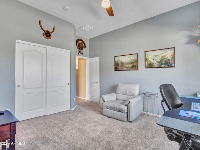 office with ceiling fan and light colored carpet