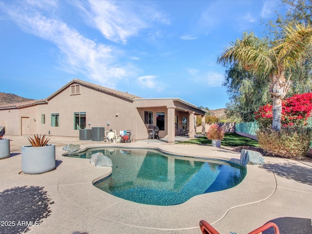 view of swimming pool featuring a patio, central AC unit, and grilling area