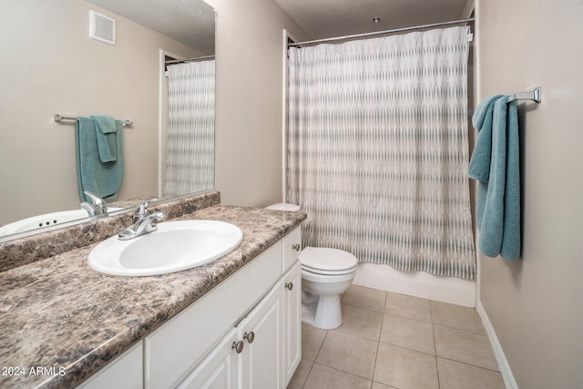 bathroom featuring a shower with curtain, vanity, toilet, and tile patterned floors