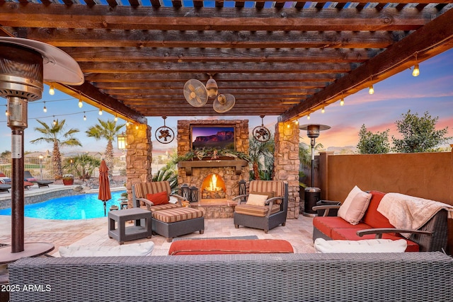 patio terrace at dusk featuring a fenced in pool, an outdoor living space with a fireplace, and a pergola